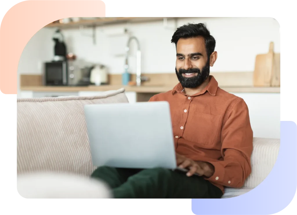 Motor dealer using his making tax digital software on a laptop